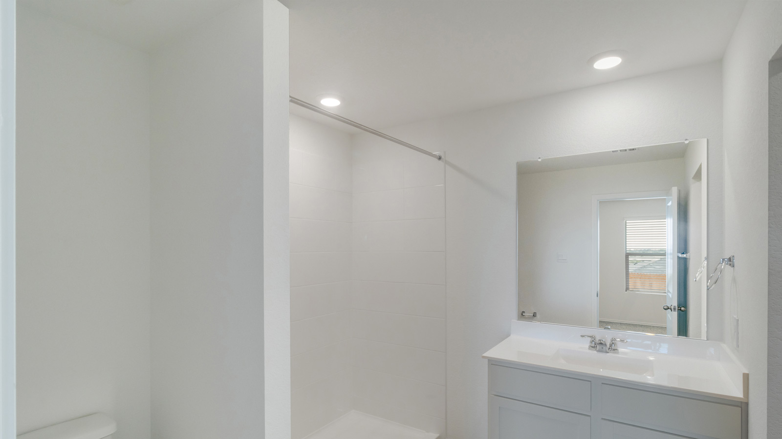 Our new home en suite design with step-in shower, bright overhead lighting, full length vanity, walk-in closet