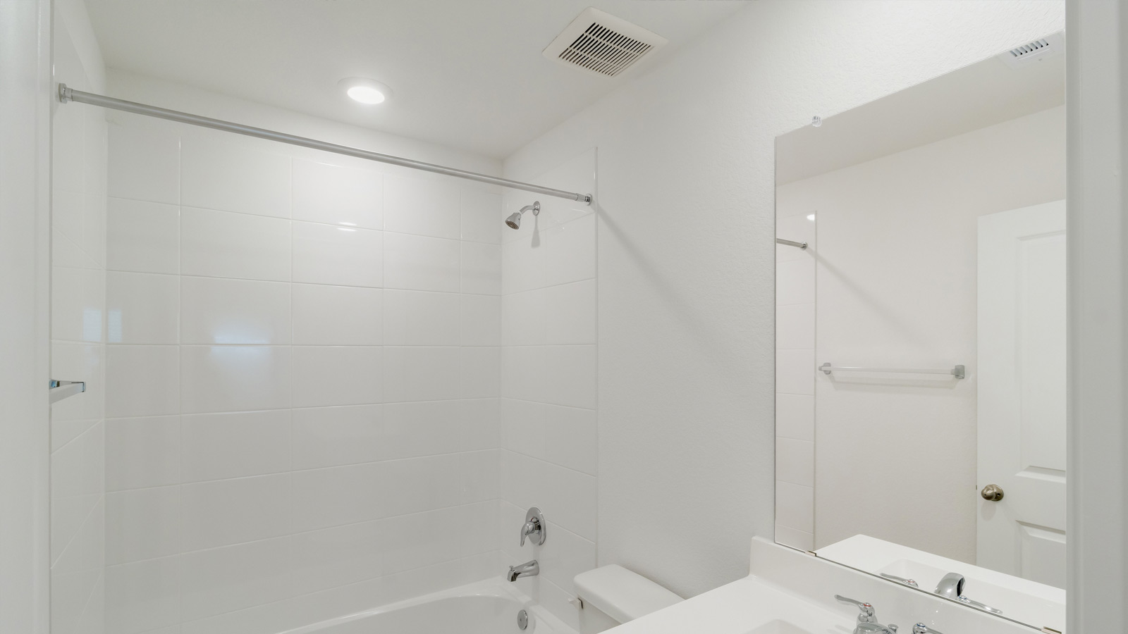Full bathroom with tub and shower surround and transom window for light and privacy at Wayside