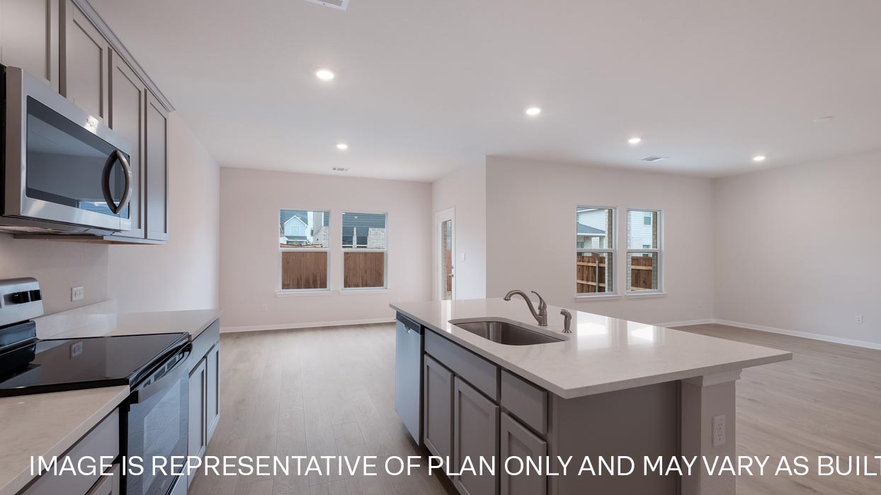 Kitchen with quartz countertops.
