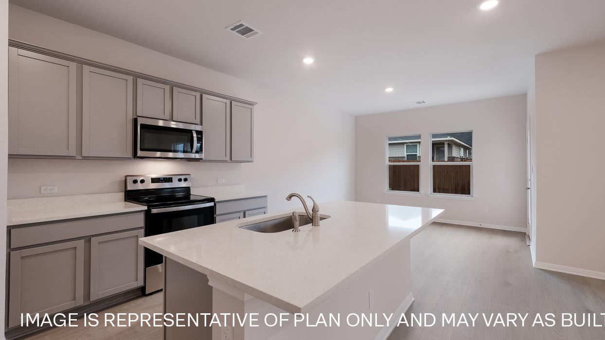 Kitchen with quartz countertops.