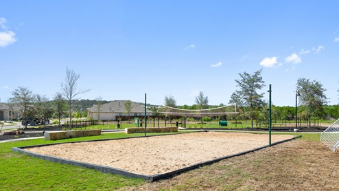 Sand volleyball court at Bar W Ranch amenity center.