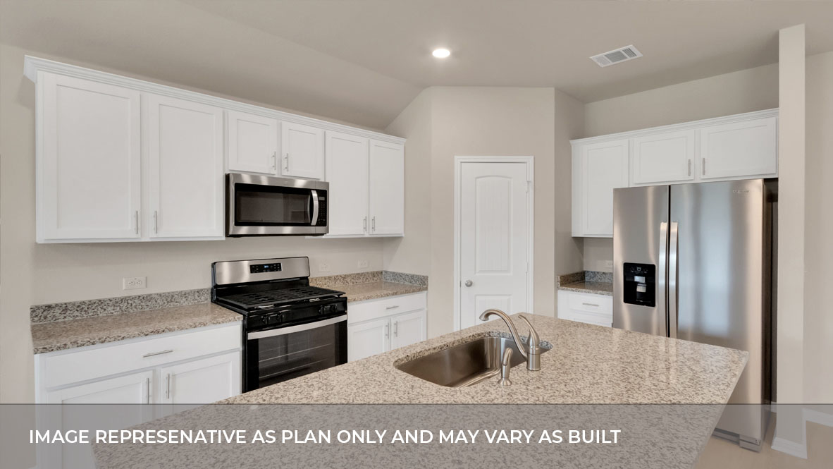 Stainless steel appliances and soldi surface countertops in the kitchen.