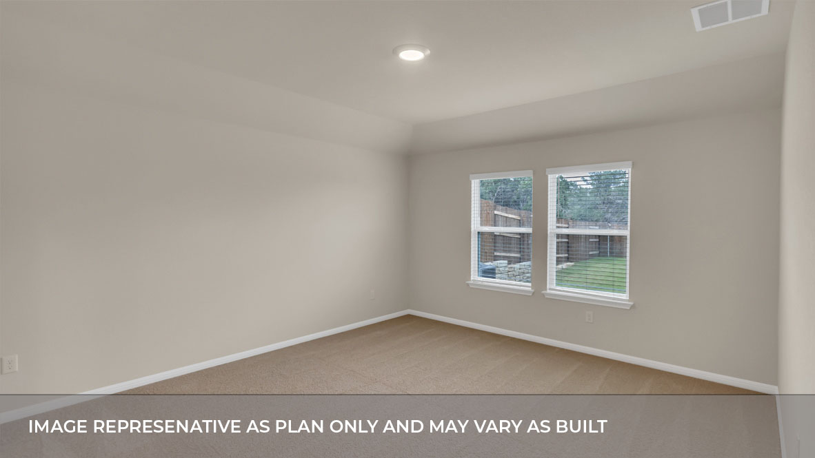 Bedroom 1 with large window and carpeted floors.