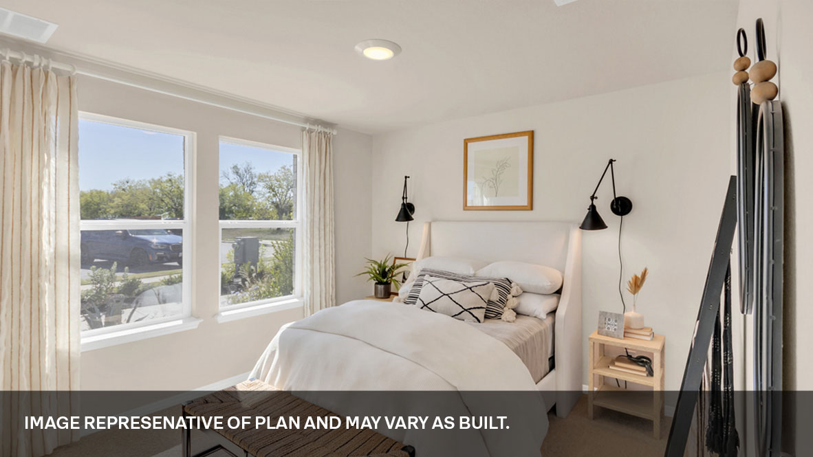 Second bedroom with large windows.