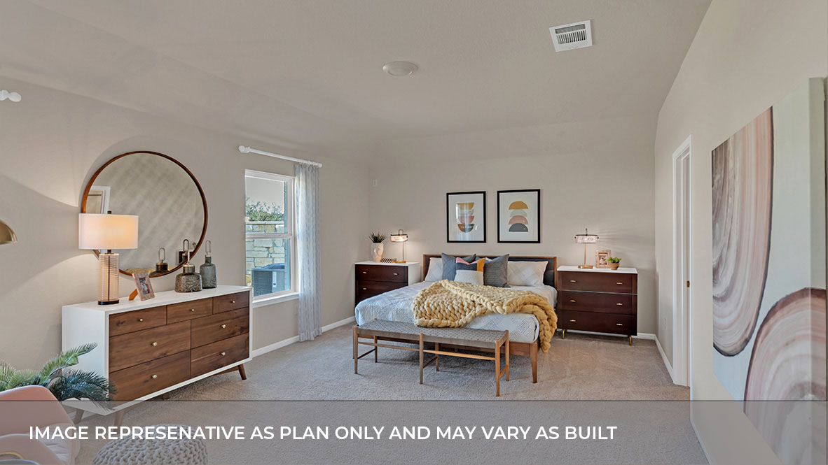 Spacious main bedroom with carpeted flooring.