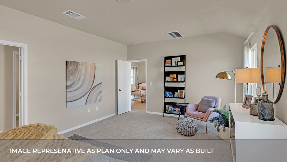 Spacious main bedroom with carpeted flooring.