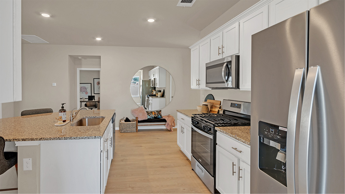 Stainless steel appliances in kitchen.