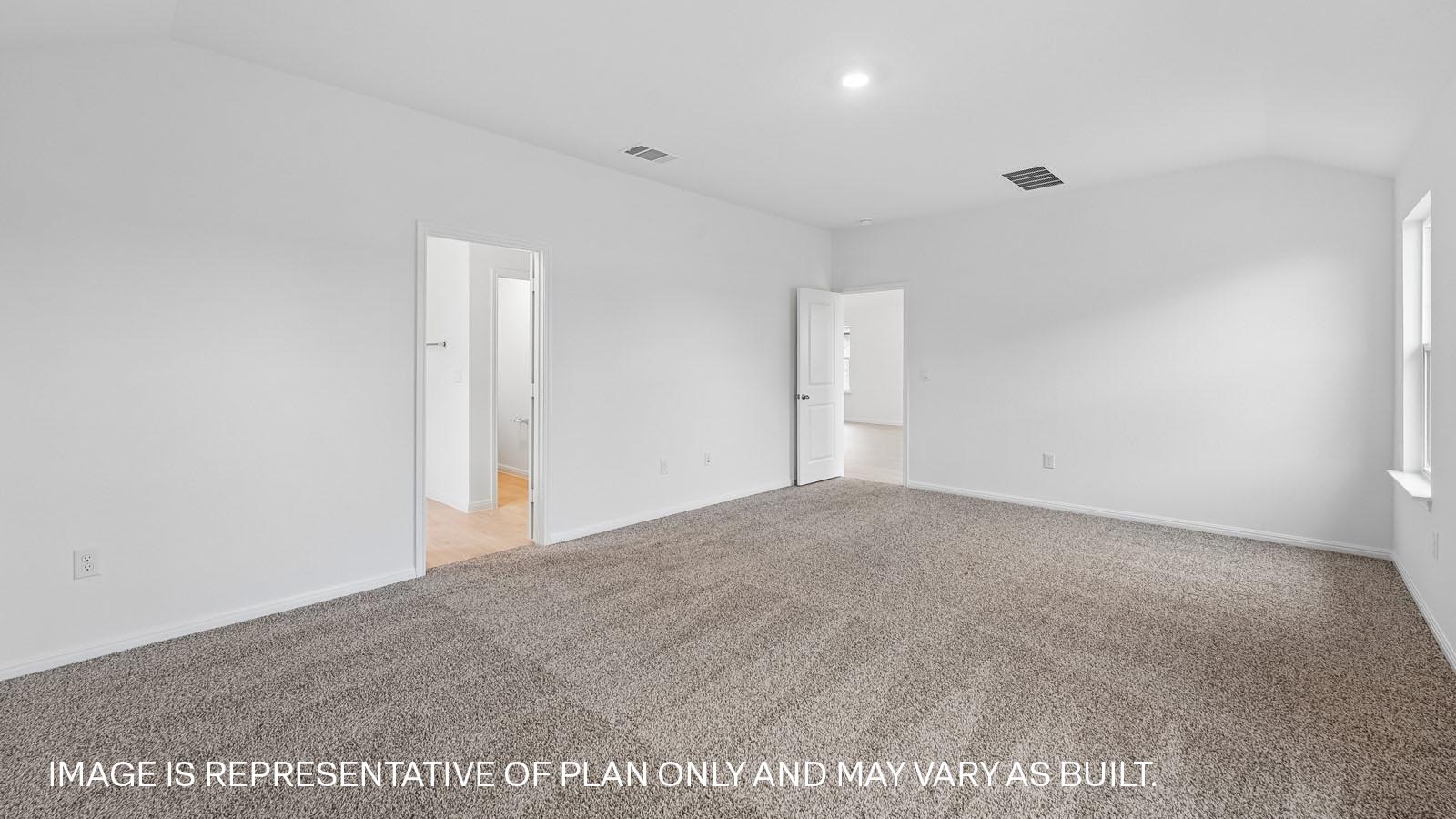 Spacious primary bedroom with ensuite.