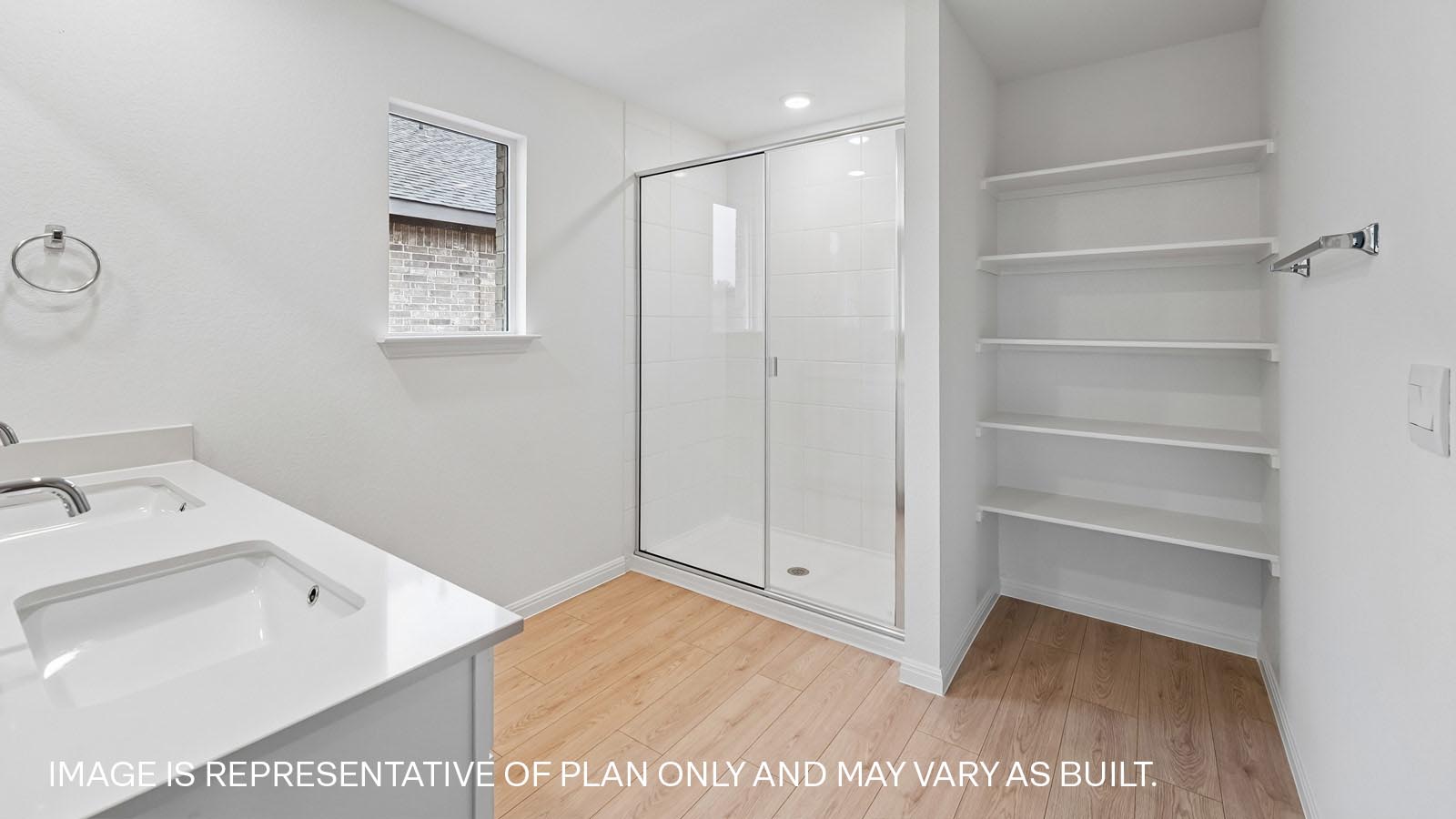 Primary bathroom with quartz vanity and walk-in shower.