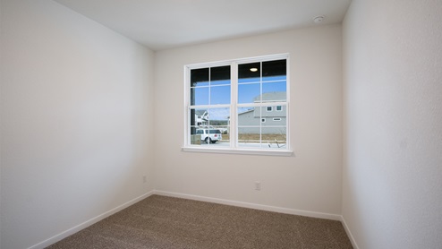 Reagan II Floorplan – 3512 –  bedroom 2 with closet and windows – Brooks Ranch in Kyle TX