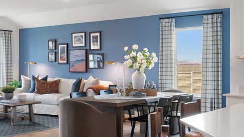 Cozy dining area with view of large window.