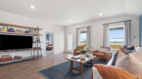 Open-concept living area with windows.