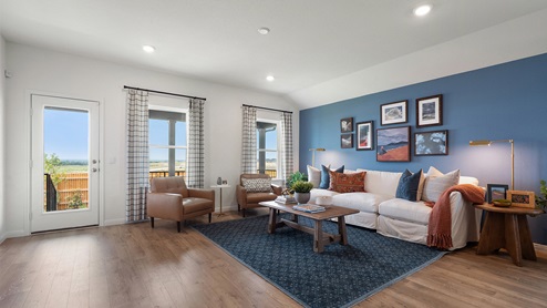 Open-concept living area with windows.