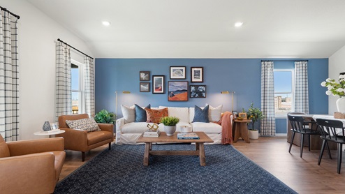 Open-concept living area with windows.