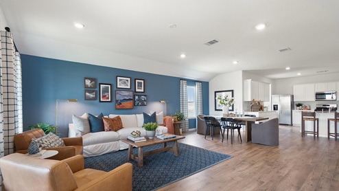 View of living room, dining area, and kitchen.