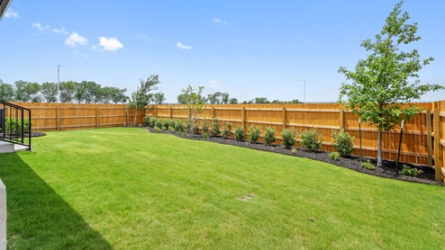 Backyard of model home at Monarch Ranch in Manor, TX.