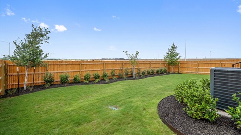 Backyard of model home at Monarch Ranch in Manor, TX.