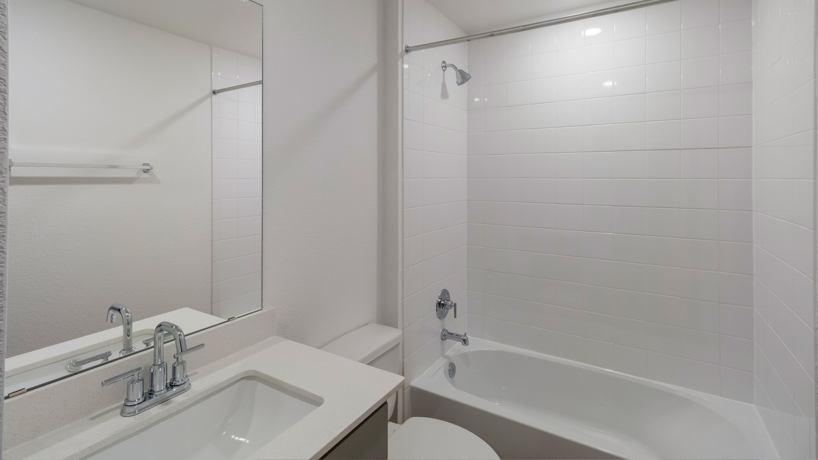bathroom with a vanity sink, toilet and shower