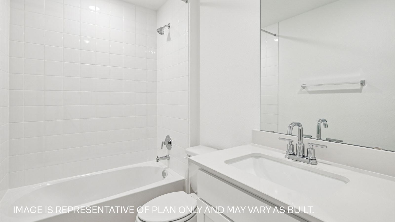 Secondary bathroom with tub and raised shower head.