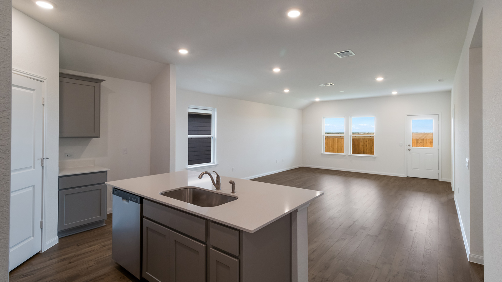 Open concept first floor with the living room and kitchen next to each other