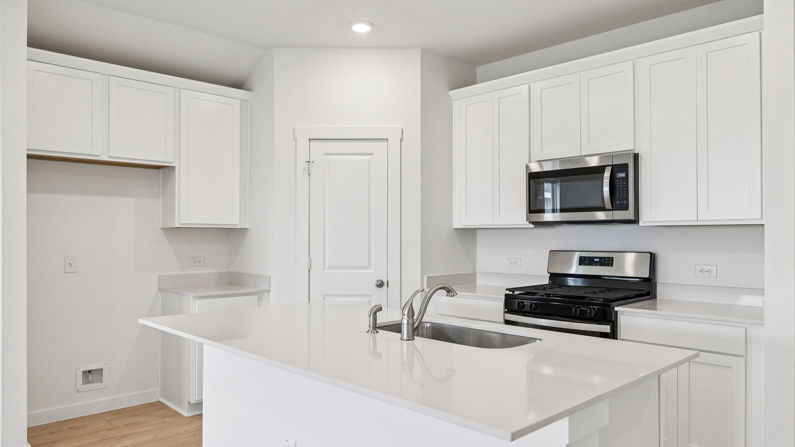 Stainless steel range, microwave, and dishwasher.