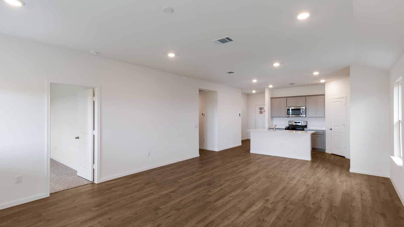 Open concept first floor with the living room and kitchen next to each other