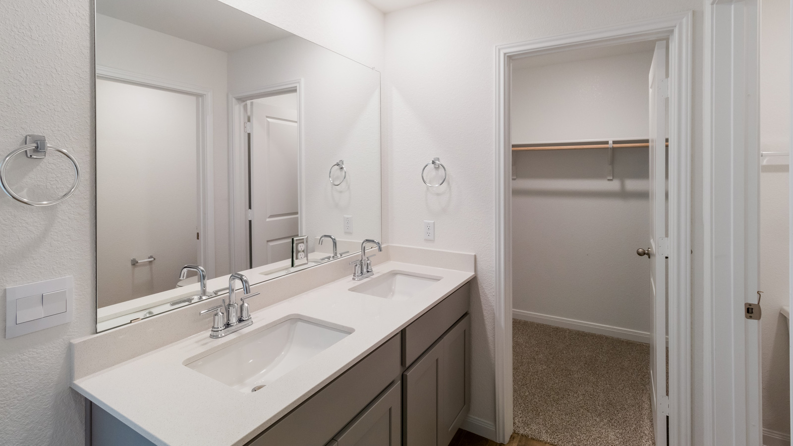 bathroom with dual vanity sinks