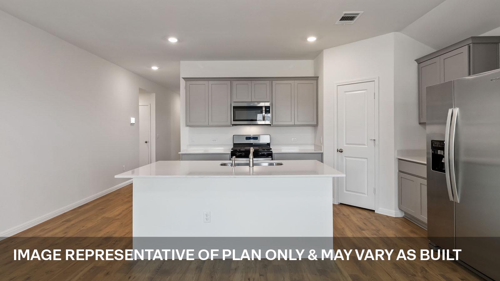 Modern kitchen with quartz countertops.