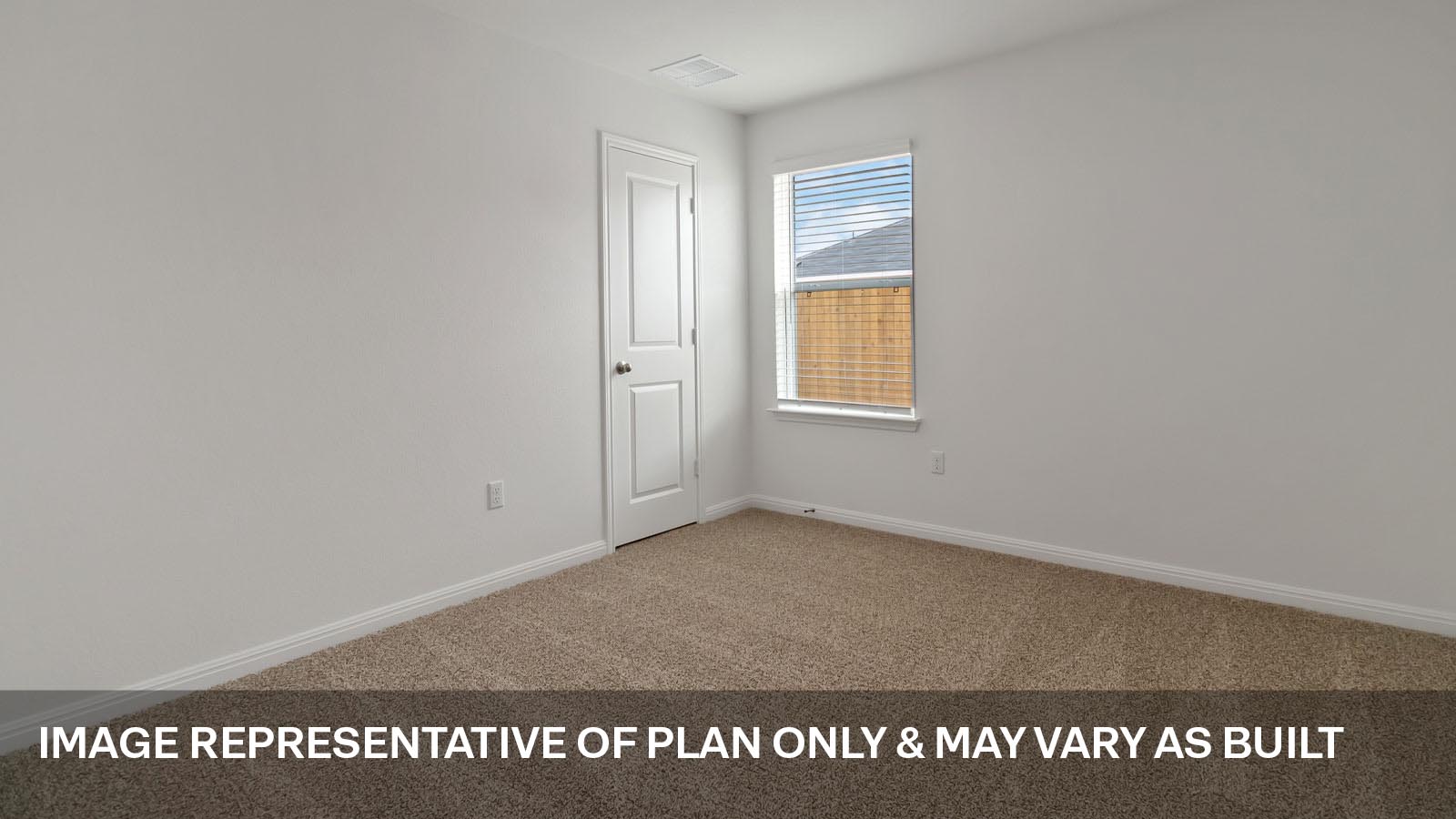 Secondary bedroom with carpeted flooring.