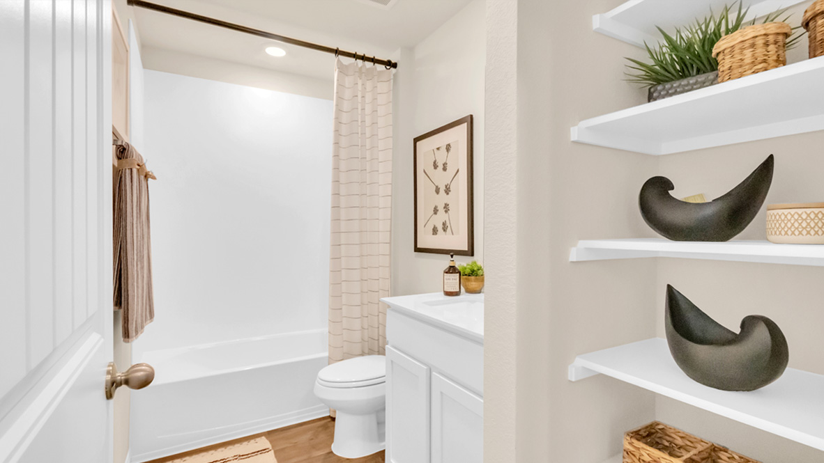 Secondary bathroom with shower and tub.