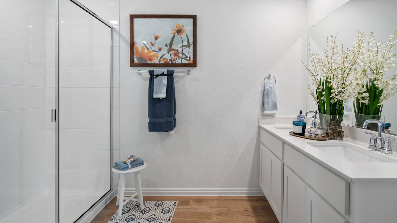 Walk-in shower and double vanity sink in bathroom 1.