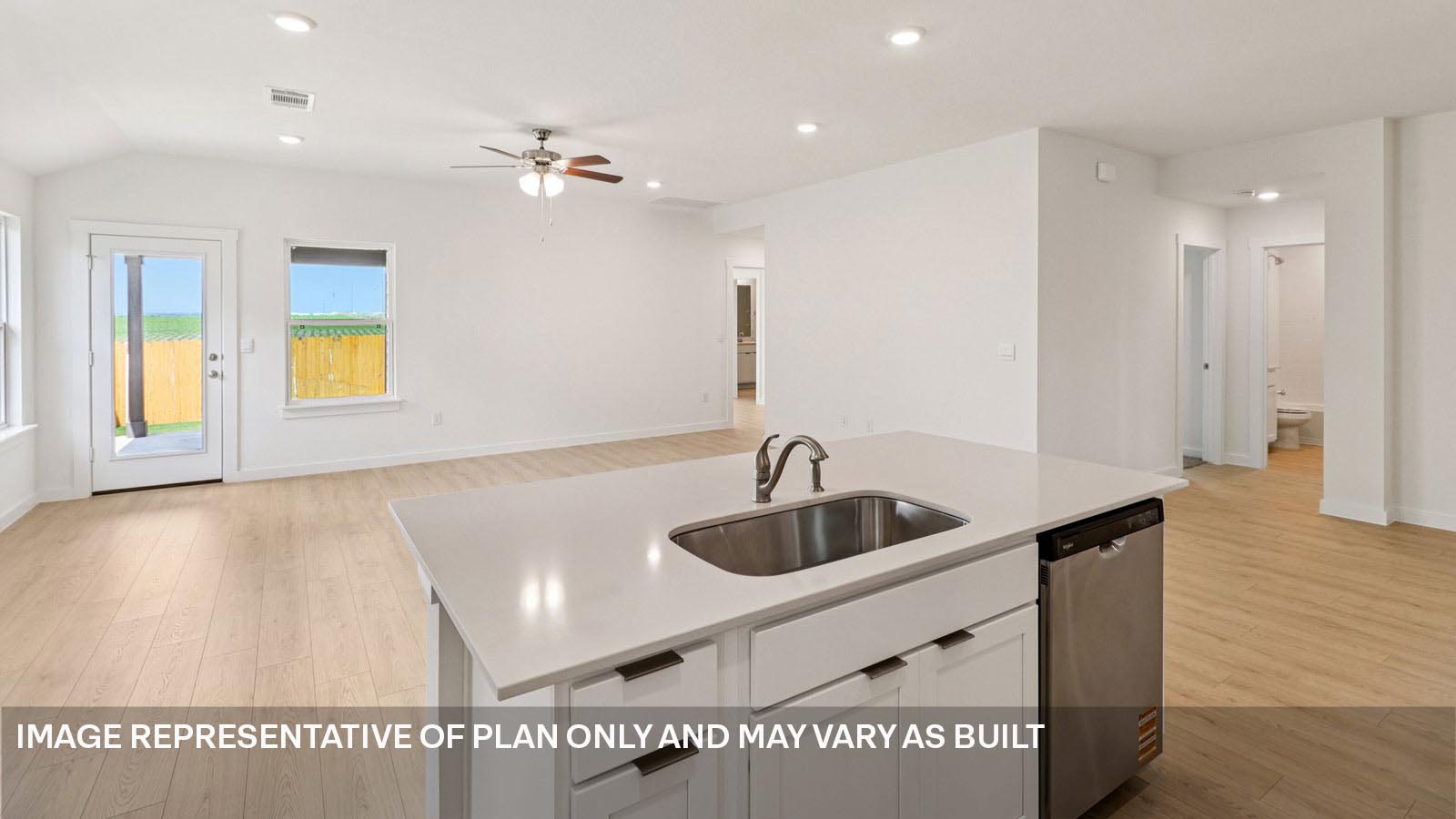 Stainless steel island with single bowl undermount sink.