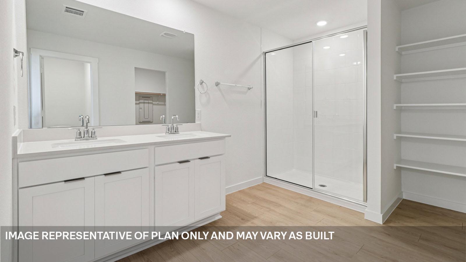 Primary bathroom with quartz vanity and walk-in shower.