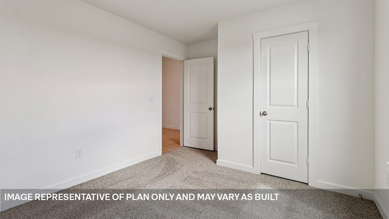 Secondary bedroom with storage closet.