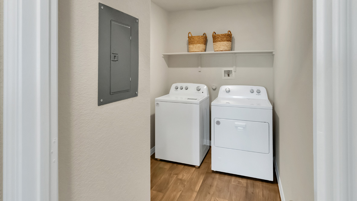 spacious laundry room with side by side washer and dryers