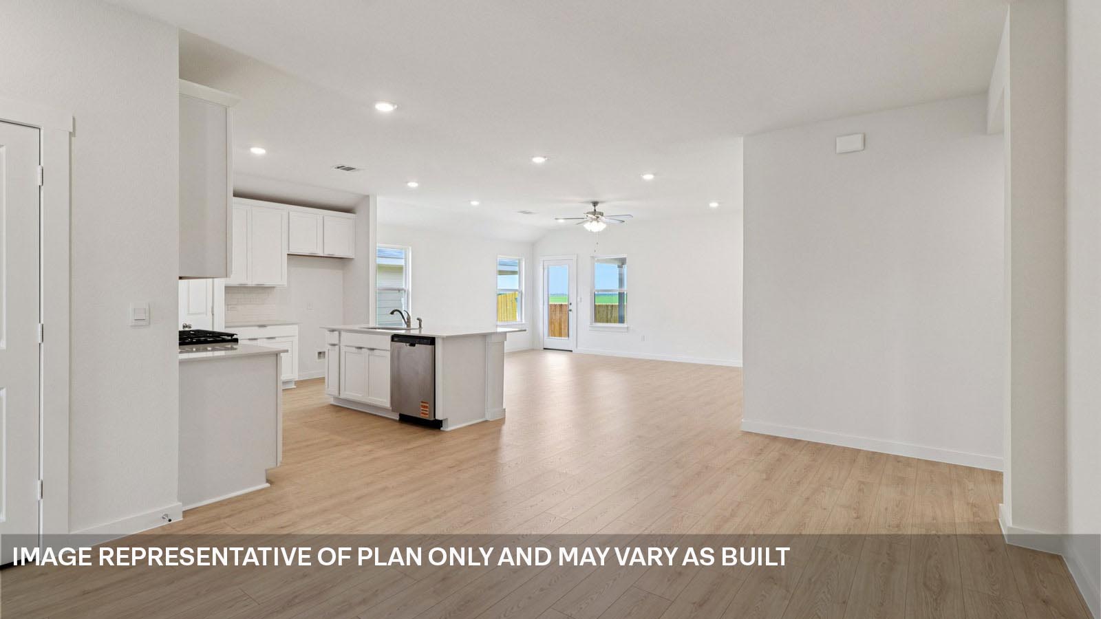 Entryway leading to kitchen with premium laminate wood plank flooring.