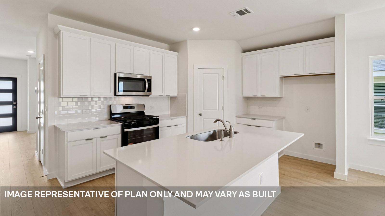 Modern kitchen with quartz countertops.