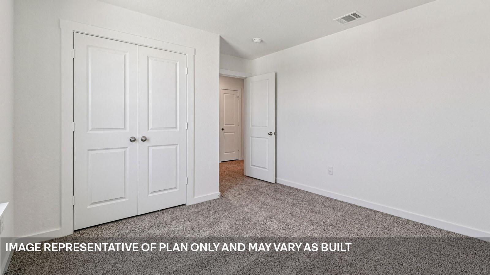 Bedroom 3 with carpeted flooring.