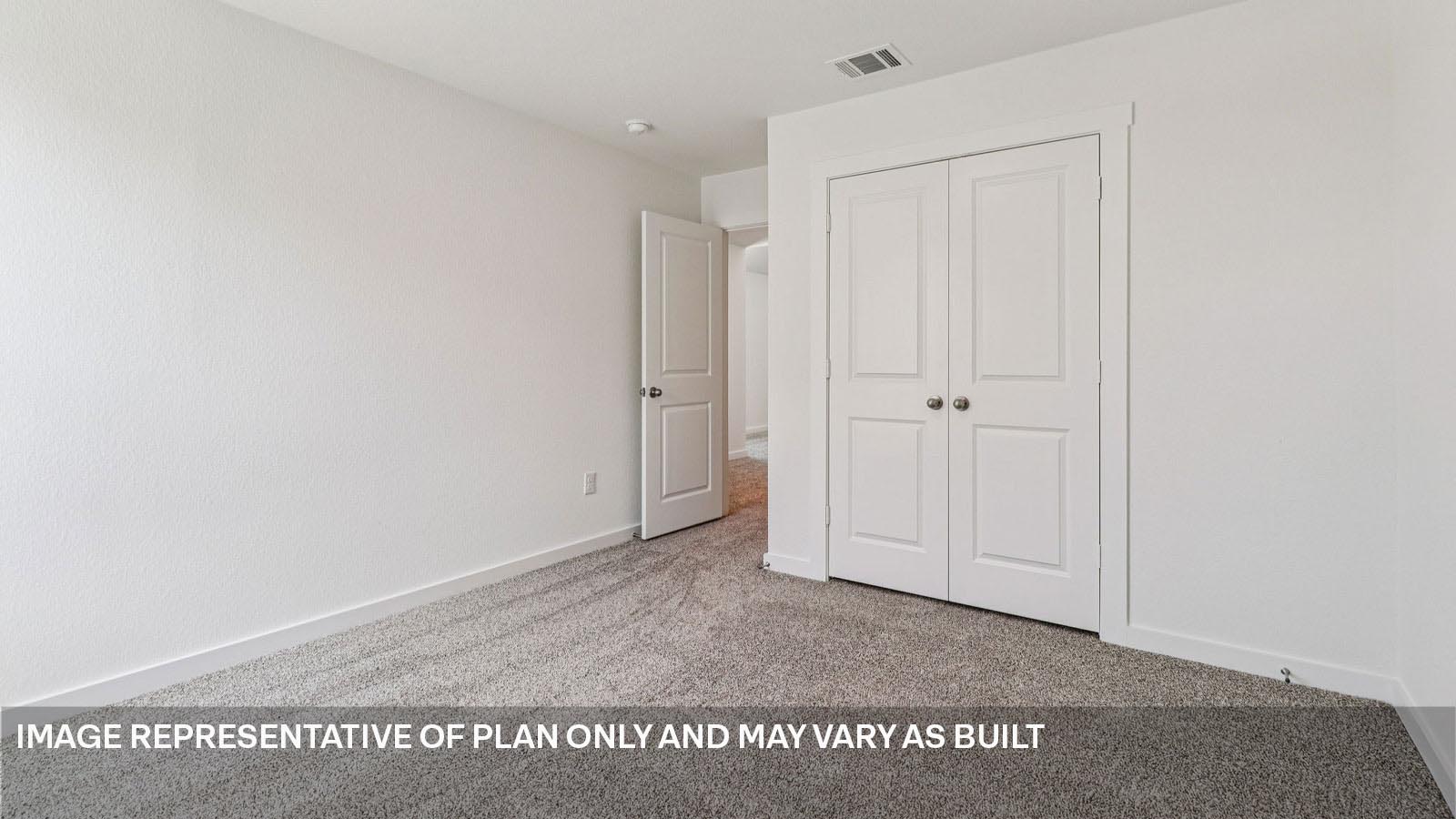 Bedroom 4 with carpeted flooring.