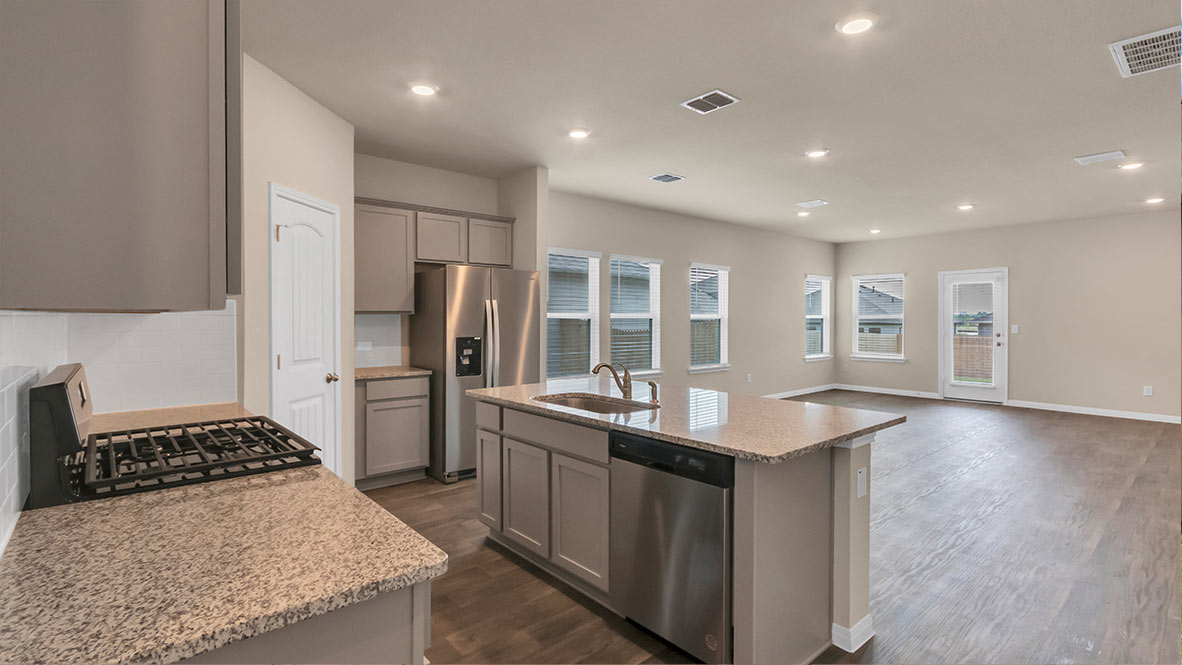 Stainless steel appliances in kitchen.