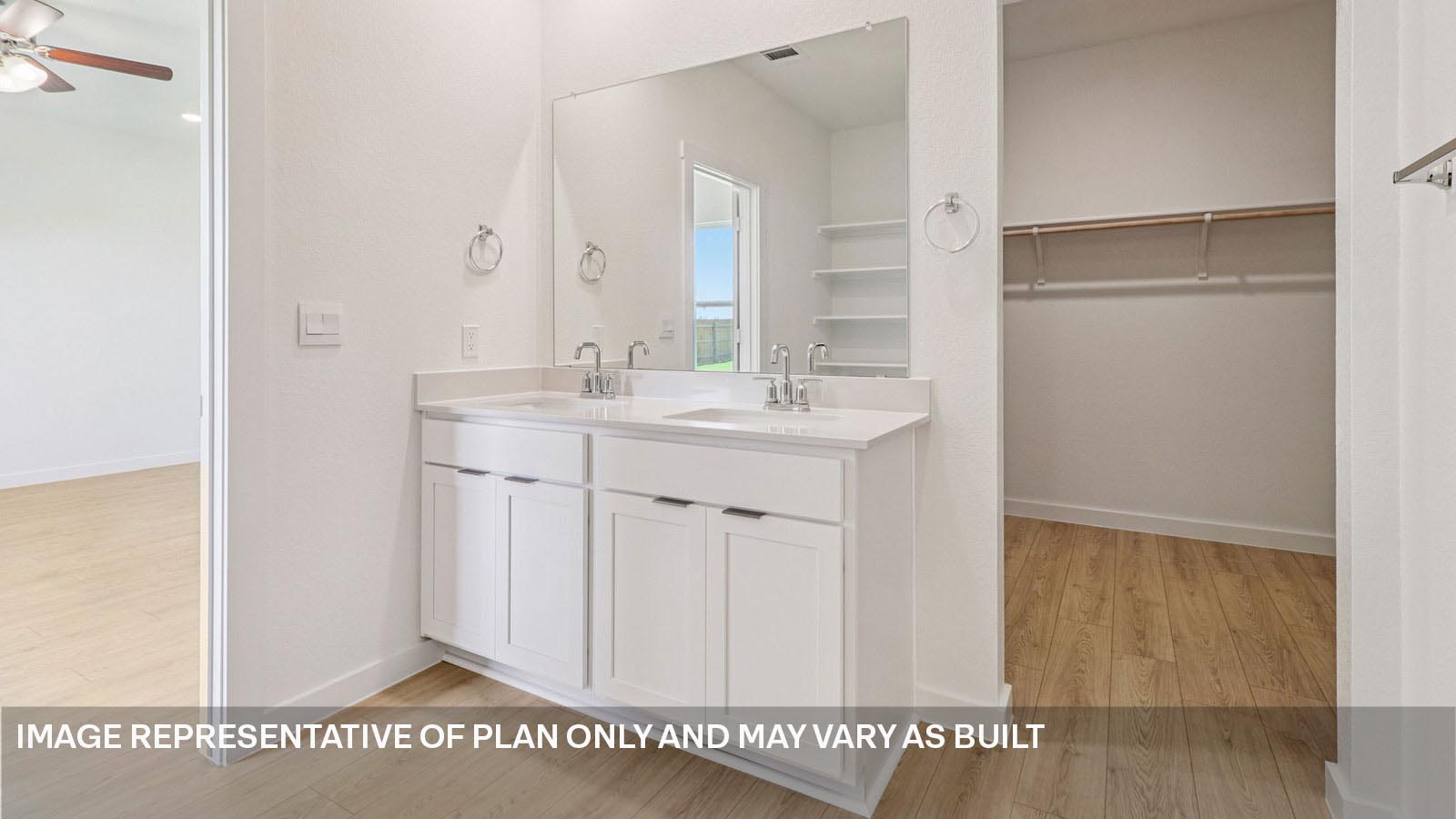 Primary bathroom with dual vanity sink.