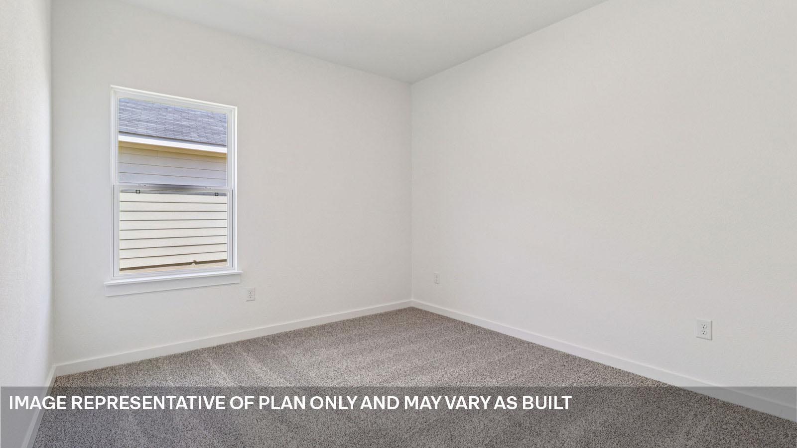 Bedroom 2 with carpeted flooring.
