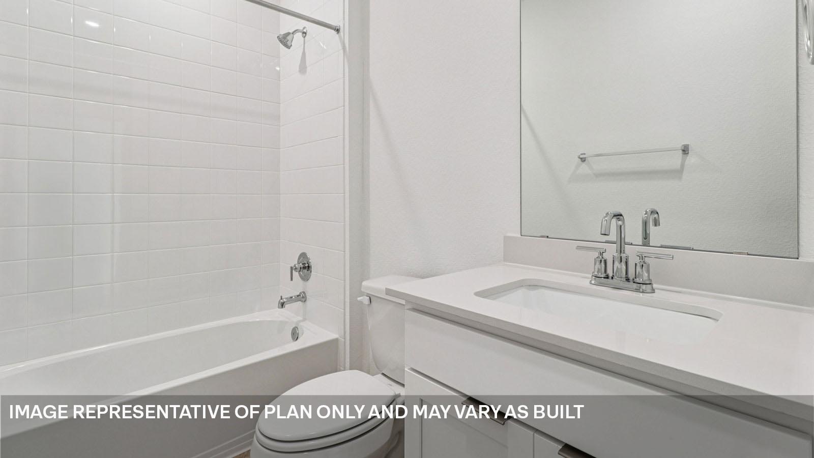 Secondary bathroom with tub and raised shower head.