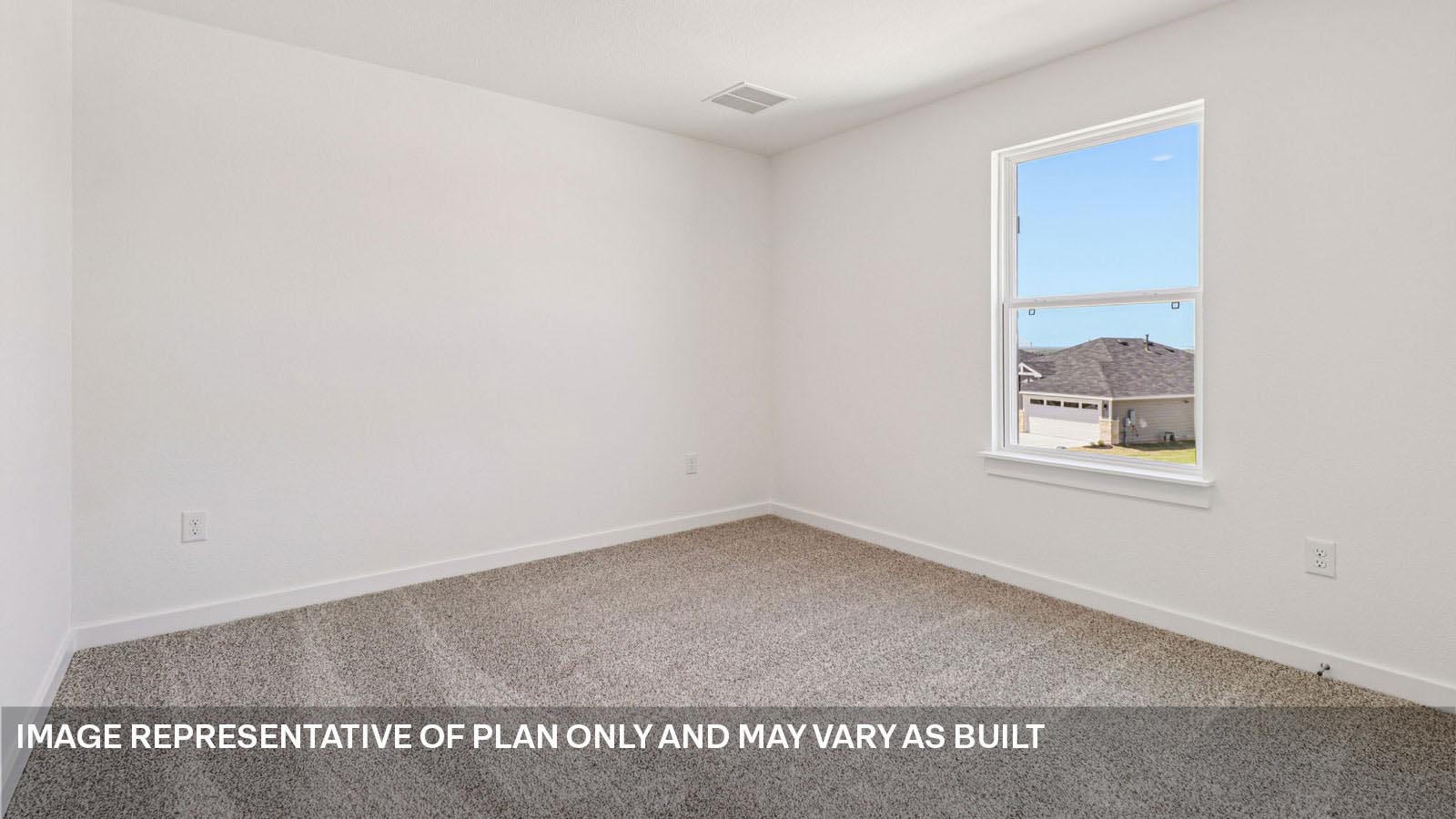 Bedroom 3 with carpeted flooring.