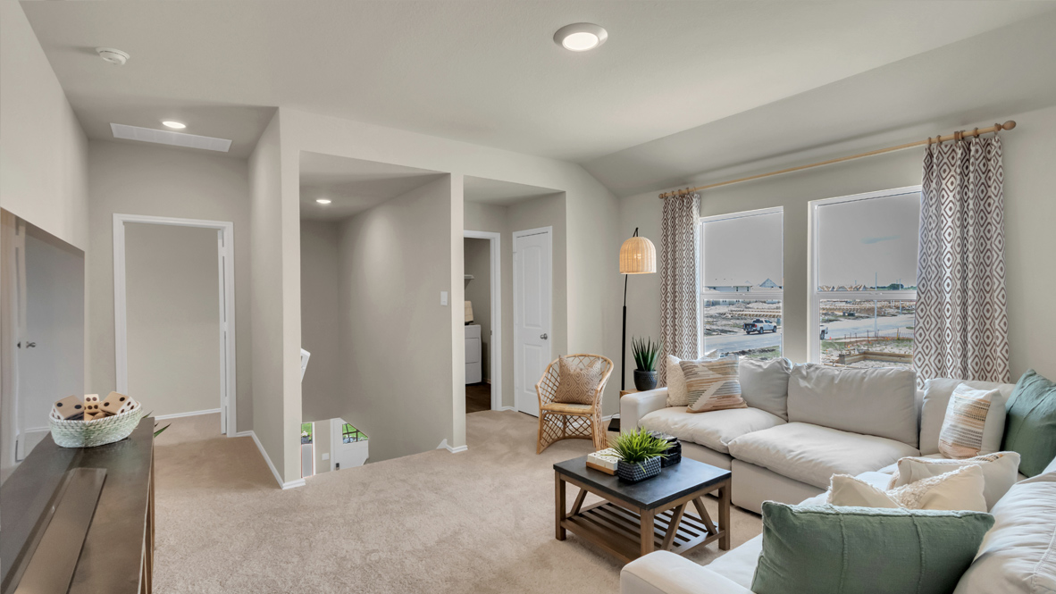 upstairs flex room with a sectional and TV