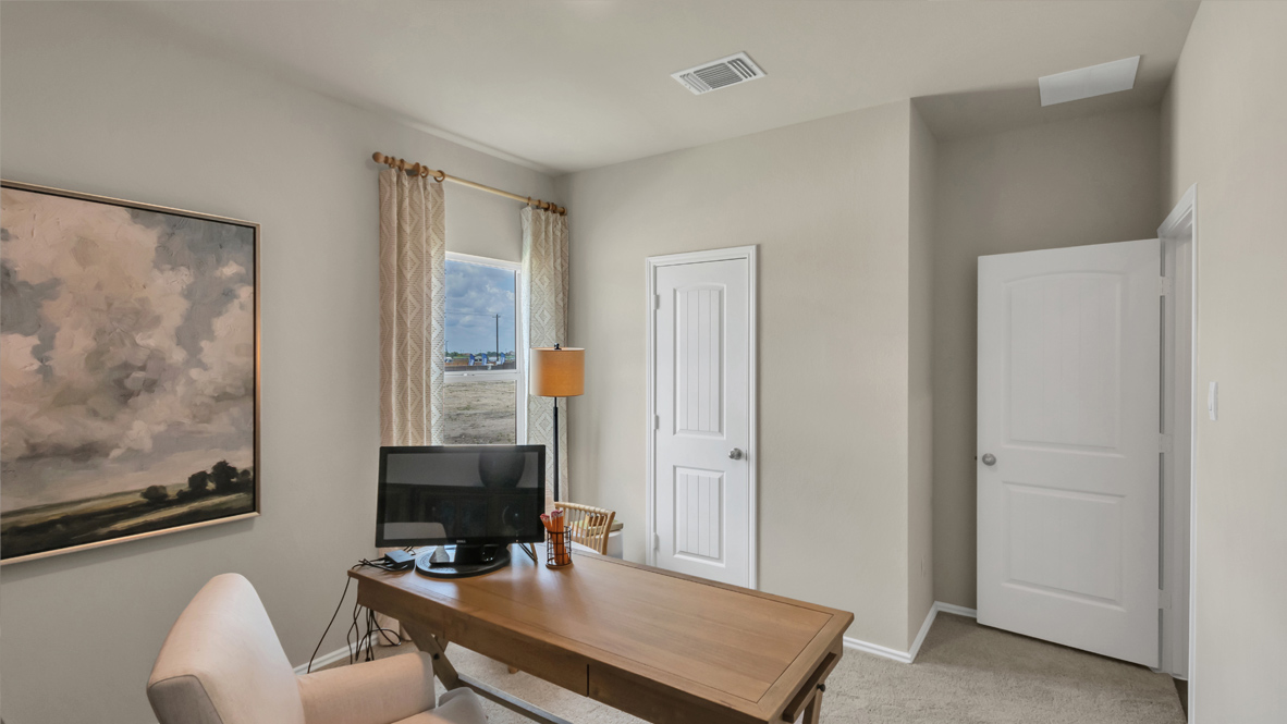 home office with a desk, chair and decor