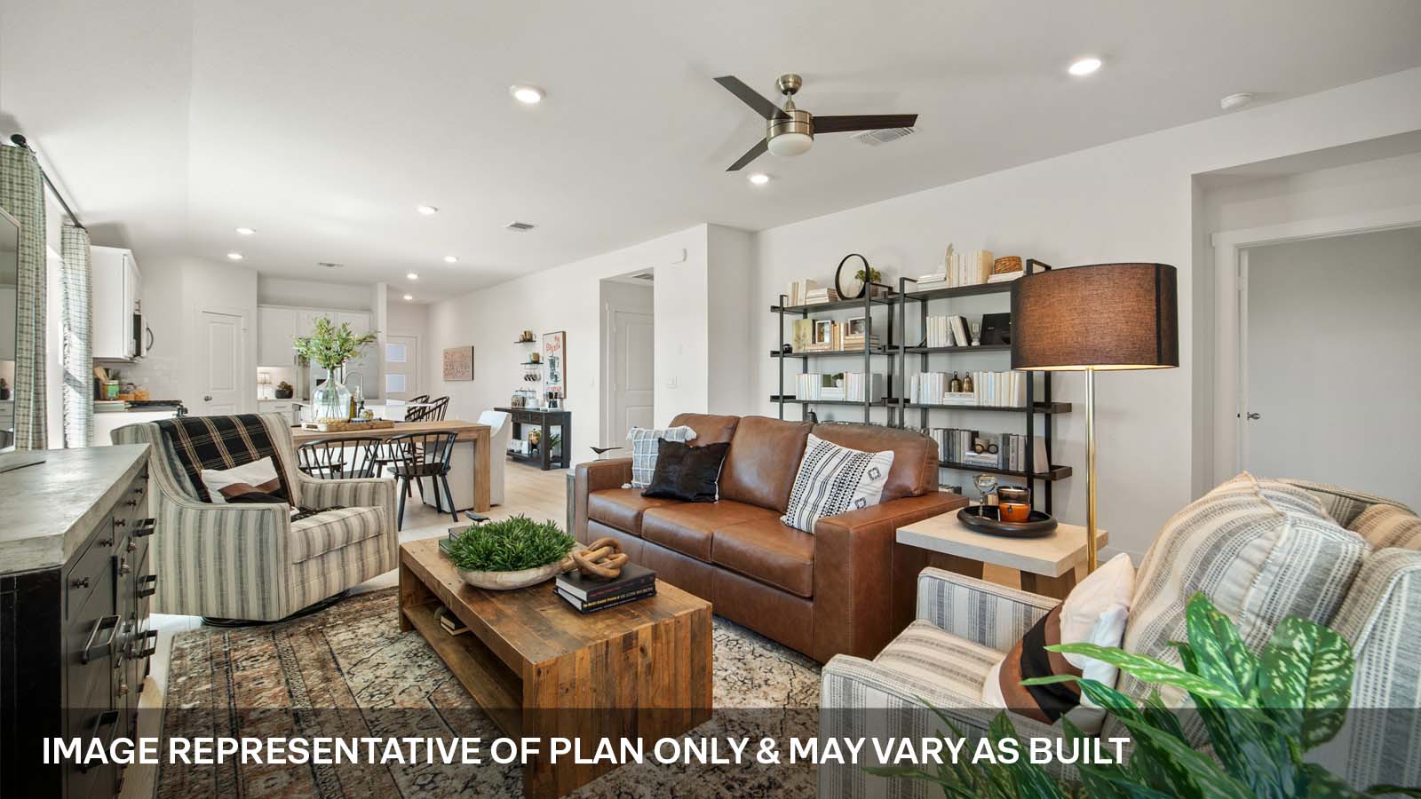 Open living area with ceiling fan.