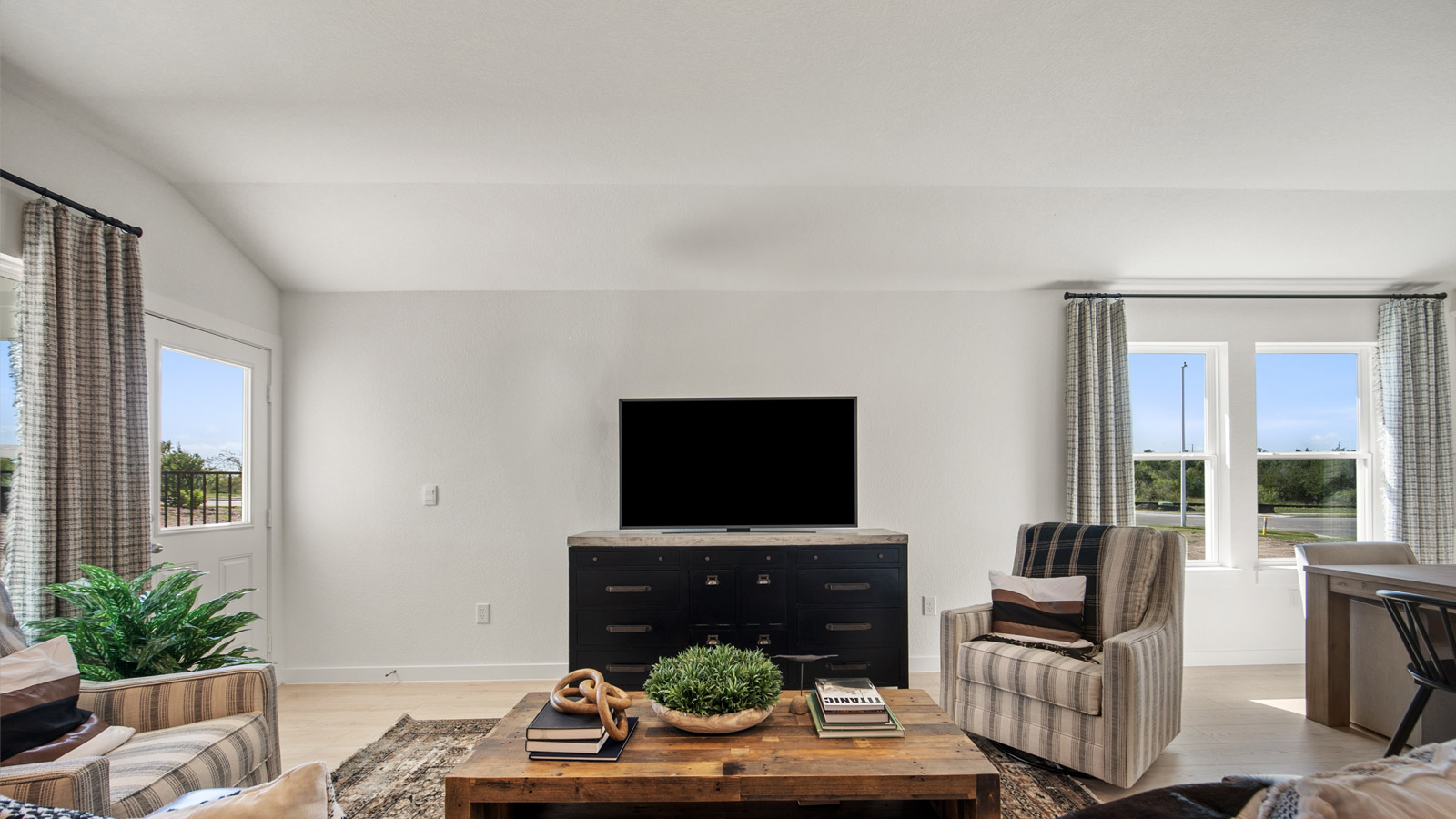 Living room with laminated wood flooring.
