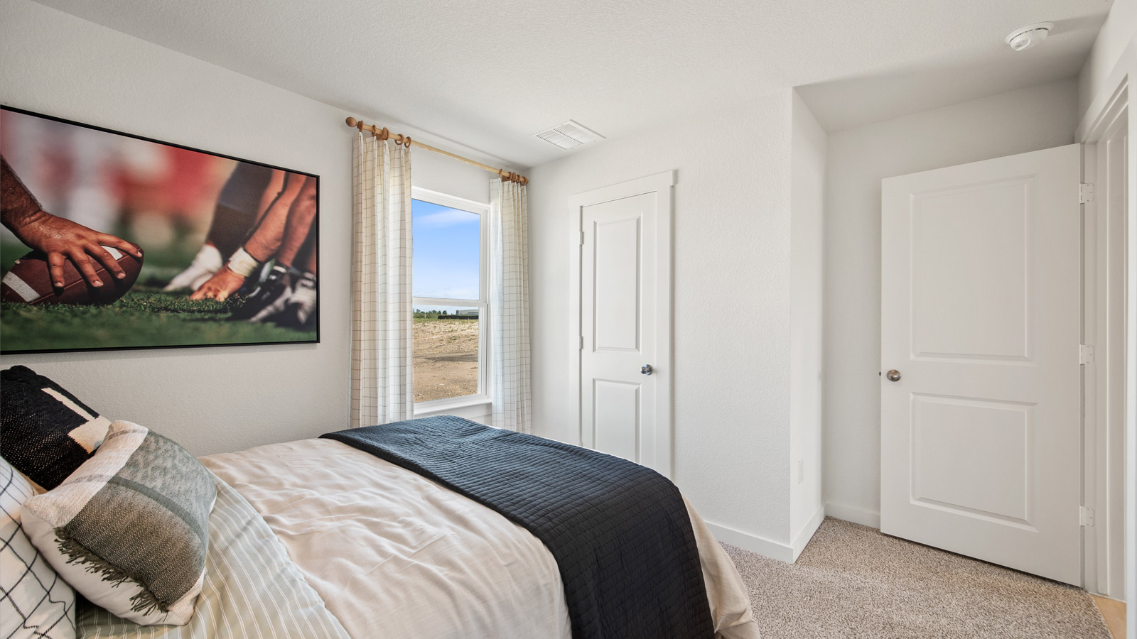 Bedroom 3 with carpeted flooring.