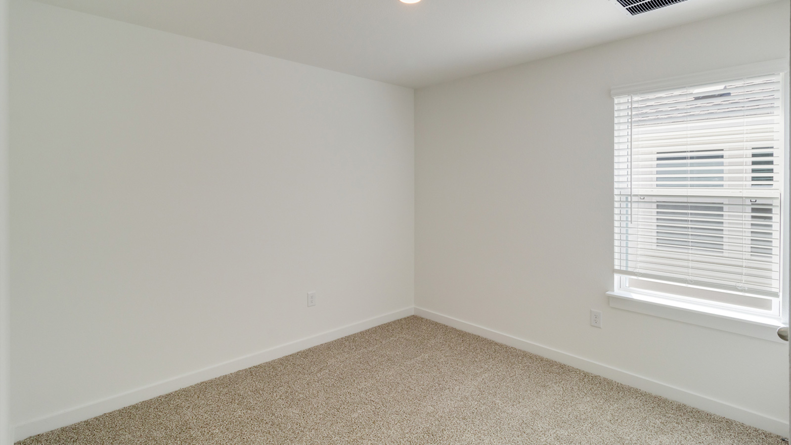Bedroom 4 with carpeted flooring.
